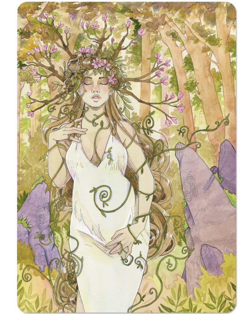 Une carte d'oracle féminin représentant une femme enceinte, les yeux fermés, dans la forêt. Des branches forment une couronne autour de sa tête.