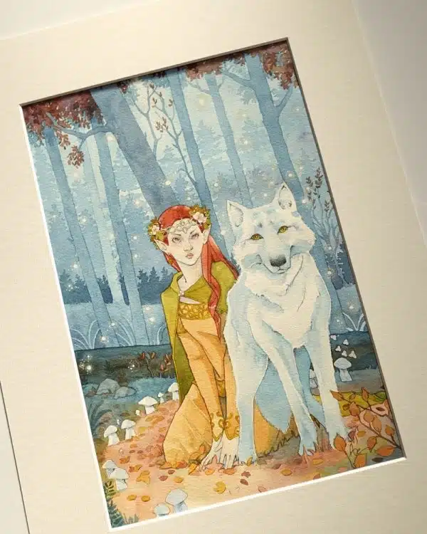Une aquarelle encadrée dans un passepartout représentant une elfe et un loup blanc au centre d'un cercle de champignons