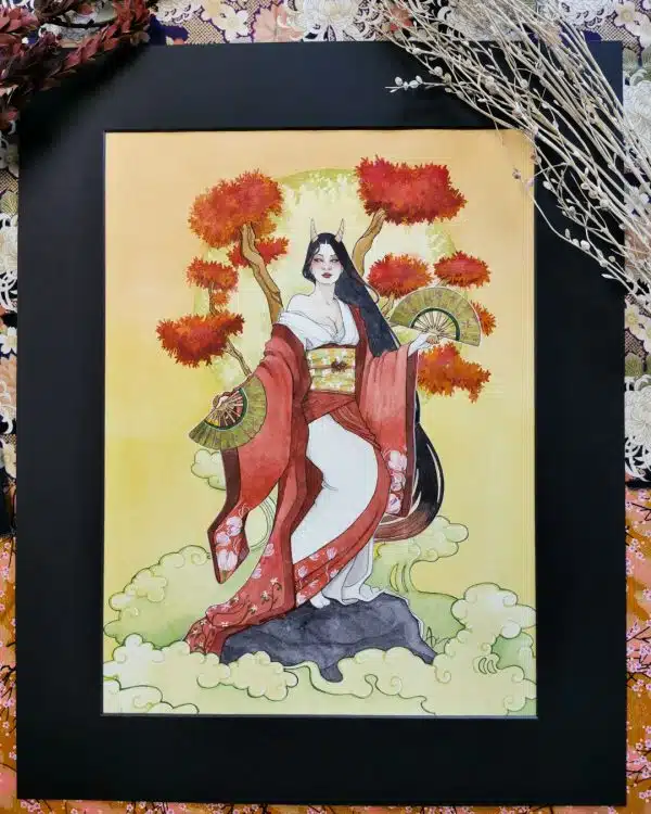Une sorcière japonaise vêtue d'un kimono rouge et blanc et d'éventails de danse. Elle se tient devant des branches d'érable rouge. Aquarelle originale issue de la collection Esprits japonais par Aemarielle