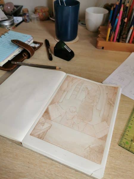 Un plan sur mon bureau en bazar et mes carnets ouverts.